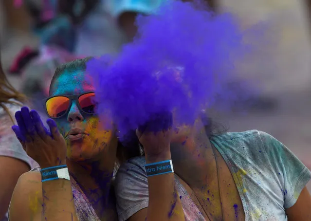 Revellers take part in the Holi Party Festival at Niemeyer Center in Aviles, northern Spain, August 27, 2016. (Photo by Eloy Alonso/Reuters)