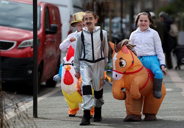 Orthodox Jewish children dressed in costumes celebrate the annual holiday of Purim in London, Britain on March 14, 2025. (Photo by Isabel Infantes/Reuters)