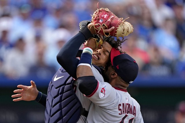 Cleveland Guardians catcher Bo Naylor and first baseman Carlos Santana collide after Naylor caught a fly foul ball for the out on Kansas City Royals' Jonathan India during the third inning of a baseball game Thursday, March 27, 2025, in Kansas City, Mo. (Photo by Charlie Riedel/AP Photo)