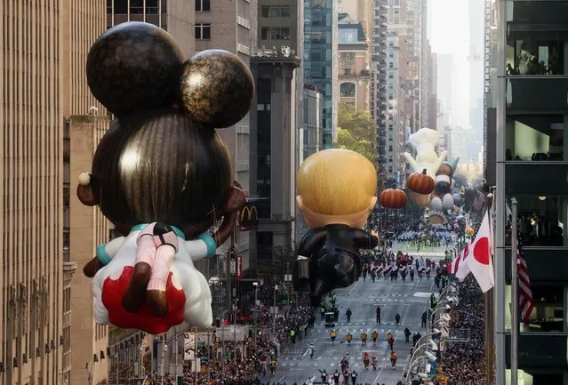 Ada Twist, Scientist, Boss Baby and Pumpkins balloons are seen during the 96th Macy's Thanksgiving Day Parade in Manhattan, New York City, U.S., November 24, 2022. (Photo by Brendan McDermid/Reuters)
