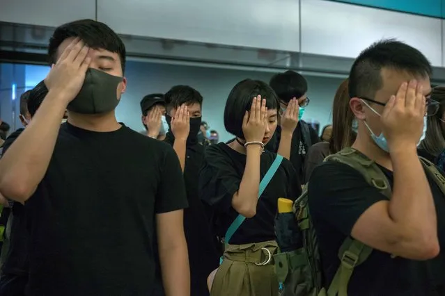 Hong Kong: Beyond the Protests. Protesters cover their right eye in solidarity with a medic who was shot in the face by police. Hong Kong, 21 August 2019. (Photo by Nicole Tung/International Festival of Photojournalism 2020)