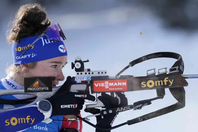 A spent cartridge pos out of the rifle of Lou Jeanmonnot, of France, as she shoots during warmup before the women 10km pursuit competition at the Biathlon World Cup event in Pokljuka, Slovenia, Saturday, January 7, 2023. (Photo by Darko Bandic/AP Photo)