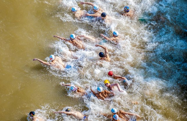 Swimmers race across the Yangtze River during the 50th Wuhan Yangtze River Crossing Festival on July 16, 2025 in Wuhan, Hubei Province of China. (Photo by VCG/VCG via Getty Images)