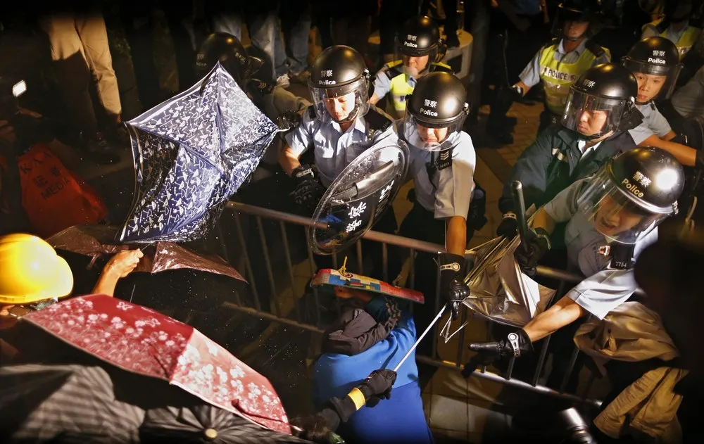 Hong Kong Protesters Scuffle with Police