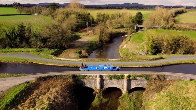 A barge makes its way across Vicarstown aqueduct on the Grand Canal over the Stradbally river in Co Laois in the Republic of Ireland on Sunday, February 26, 2023. (Photo by Niall Carson/PA Wire Press Association)