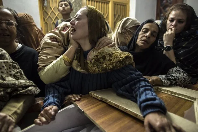 A mother mourns her son Mohammed Ali Khan, 15, a student who was killed during an attack by Taliban gunmen on the Army Public School, at her house in Peshawar December 16, 2014. Taliban gunmen in Pakistan took hundreds of students and teachers hostage on Tuesday in a school in the northwestern city of Peshawar, military officials said. (Photo by Zohra Bensemra/Reuters)