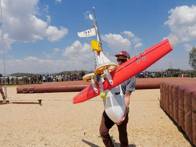 Zipline engineer carry a drone at their operation base in Muhanga south of Rwanda's capital Kigali where Zipline, a California-based robotics company delivered their first blood to patients using a drone October 12, 2016. (Photo by James Akena/Reuters)