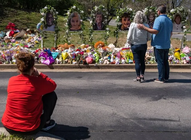 People visit a makeshift memorial at the entrance of The Covenant School on April 1, 2023 in Nashville, Tennessee. Three students and three adults were killed by the 28-year-old shooter on Monday. (Photo by Seth Herald/Getty Images)