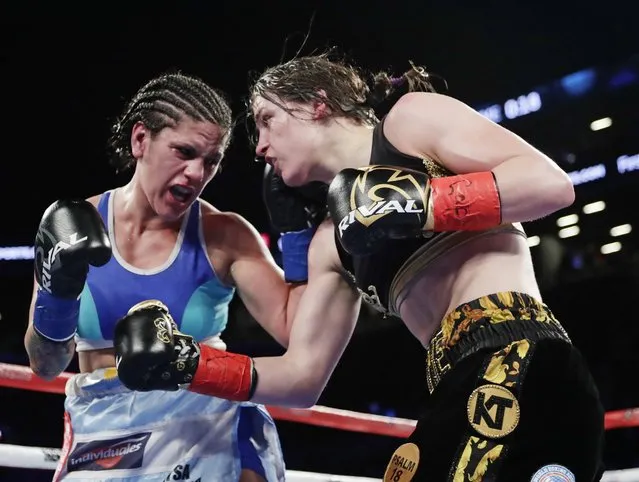 Argentina's Victoria Noelia Bustos, left, punches Ireland's Katie Taylor, right, during the eighth round of a women's lightweight championship boxing match Saturday, April 28, 2018, in New York. Taylor won the fight. (Photo by Frank Franklin II/AP Photo)