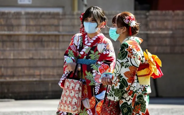 Tourists wearing kimono and protective masks visit Sensoji Temple in Asakusa district in Tokyo, Japan, February 18, 2020. (Photo by Athit Perawongmetha/Reuters)