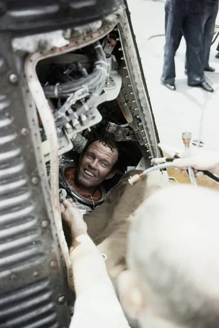 Astronaut Leroy Gordon Cooper broke into a broad grin at the greeting given to him aboard the carrier Kearsarge after his 22-orbit earth flight in May of 1963. Cooper and his spacecraft, Faith 7, were lifted from the Pacific Ocean by a helicopter from the Kearsarge on May 17, 1963. It was the longest U.S. space flight to date. (Photo by AP Photo)