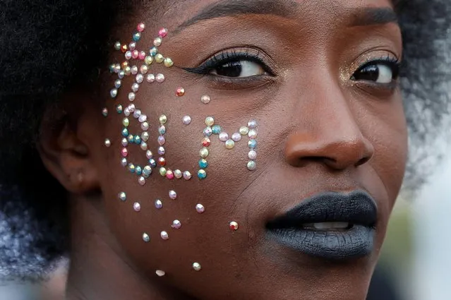 A woman attends a banned demonstration planned in memory of Adama Traore, a 24-year old black Frenchman who died in a 2016 police operation which some have likened to the death of George Floyd, in front of a courthouse in Paris, France on June 2, 2020. (Photo by Gonzalo Fuentes/Reuters)