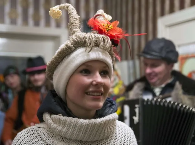 People sing Christmas carols, known locally as “Kolyadki”, in the village of Noviny, east of the capital Minsk, January 13, 2015. (Photo by Vasily Fedosenko/Reuters)