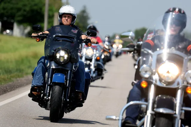 Former Vice President Mike Pence rides a Harley Davidson motorcycle during Joni Ernst's Roast and Ride event on June 03, 2023 in Des Moines, Iowa. The annual event helps to raise money for veteran charities and highlight Republican candidates and platforms. Pence is expected to announce that he is seeking the Republican nomination for President next week in Des Moines. (Photo by Scott Olson/Getty Images)