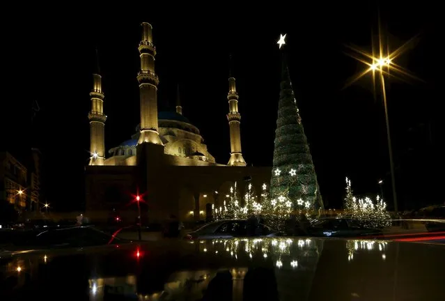 A Christmas tree designed by Lebanese designer Elie Saab is seen in front of al Amin mosque in Beirut, Lebanon, December 12, 2015. (Photo by Jamal Saidi/Reuters)