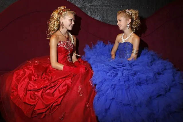 Contestants chat backstage during the “mini-miss” beauty contest in Bobigny, Paris suburb, September 22, 2012. The competition is open for girls aged 7 to 12. (Photo by Benoit Tessier/Reuters)