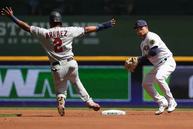 Luis Arraez #2 of the Minnesota Twins is forced out at second base as Luis Urias #2 of the Milwaukee Brewers makes a throw to first base during a game at American Family Field on April 04, 2021 in Milwaukee, Wisconsin. (Photo by Stacy Revere/Getty Images)
