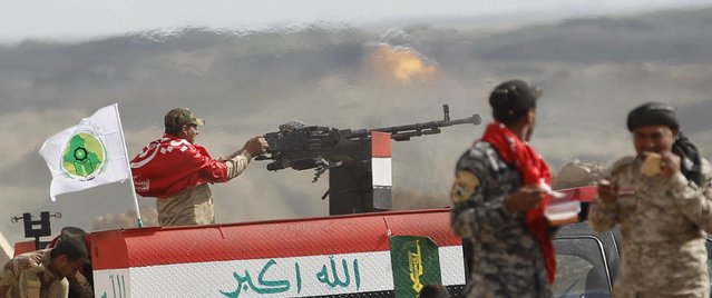 Iraqi security forces and Shi'ite fighters clash with Islamic State militants in Salahuddin province March 2, 2015. Iraq's armed forces, backed by Shi'ite militia, attacked Islamic State strongholds north of Baghdad on Monday as they launched an offensive to retake the city of Tikrit and the surrounding Sunni Muslim province of Salahuddin. REUTERS/Thaier Al-Sudani 