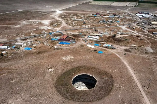 In an aerial view, a massive sinkhole is seen on the outskirts of a village on June 03, 2021, in Karapinar, Turkey. (Photo by Chris McGrath/Getty Images)