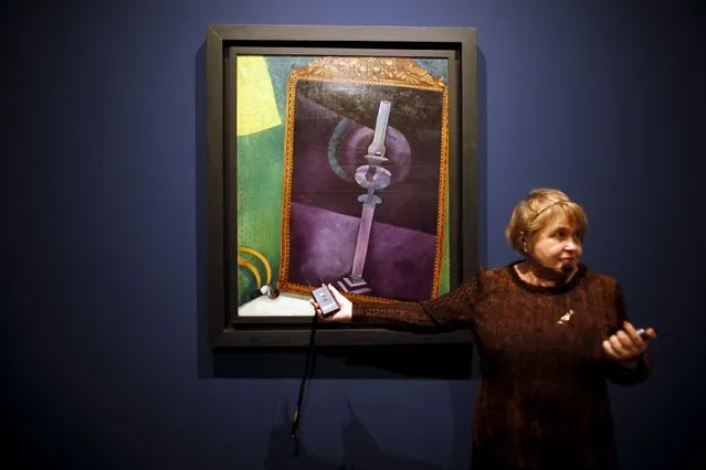 Russian State Museum's vice director Eugenia Petrova talks to journalists next to “Mirror” by Russian-born artist Marc Chagall during an international press tour of the Malaga branch of the State Museum of Russian Art of St Petersburg, a day before its inauguration in Malaga, southern Spain March 24, 2015. (Photo by Jon Nazca/Reuters)
