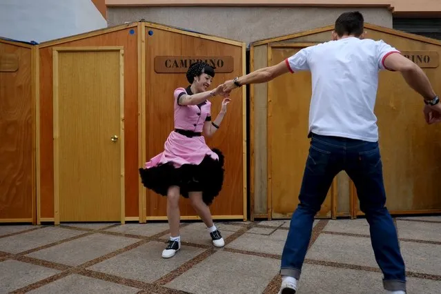 People dressed in fifties-style outfits, dance during the 22th Rockin' Race Jamboree International Festival in downtown Torremolinos, near Malaga, southern Spain, February 6, 2016. (Photo by Jon Nazca/Reuters)