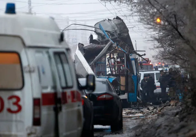 Members of the emergency services work at the site of a bomb blast on a trolleybus in Volgograd December 30, 2013. (Photo by Sergei Karpov/Reuters)