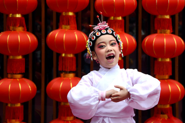 A child performs opera during celebrations on the eight day of Chinese Lunar New Year of the Pig, in Taizhou, Zhejiang province, China February 12, 2019. (Photo by Reuters/China Stringer Network)