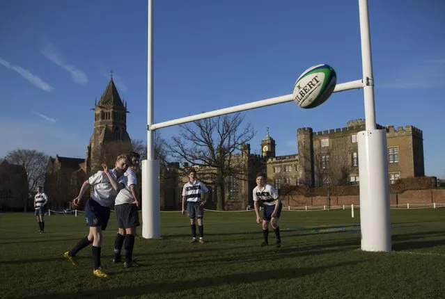Pupils take part in rugby practice on the playing fields of Rugby School in central England, January 20, 2015. (Photo by Neil Hall/Reuters)