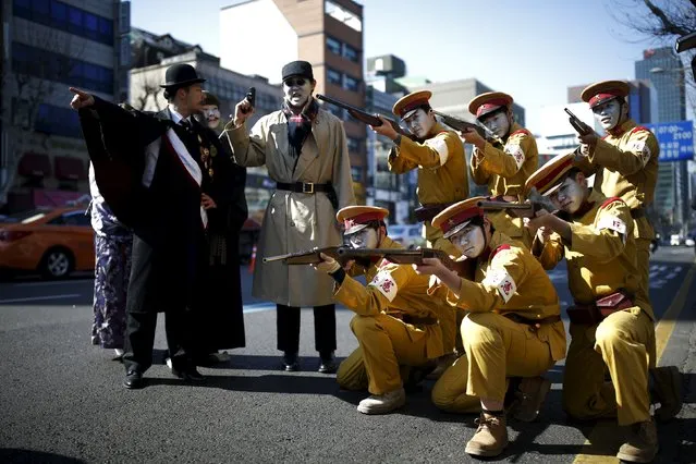 Performers acting as Japanese soldiers pose on a street as they take part in a re-enactment of the Independence Movement Day in Seoul, South Korea, March 1, 2016. (Photo by Kim Hong-Ji/Reuters)