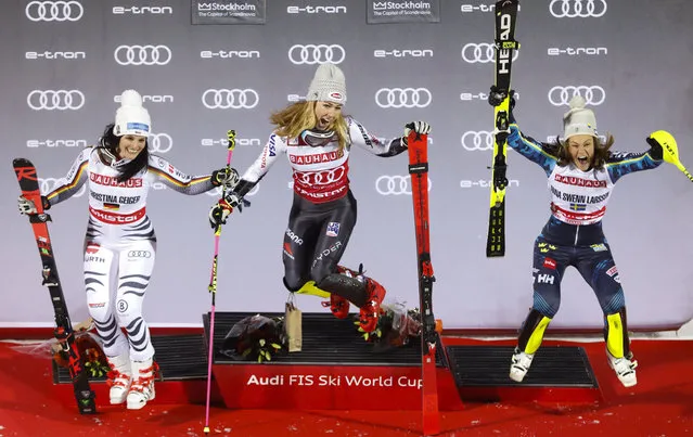 United States' Mikaela Shiffrin, center, winner of an alpine ski World Cup women's parallel slalom city event, celebrates on the podium with second-placed Germany's Christina Geiger, left, and third-placed Sweden's Anna Swenn Larsson, in Hammarbybacken, Stockholm, Sweden, Tuesday, February 19, 2019. (Photo by Christine Olsson/TT via AP Photo)