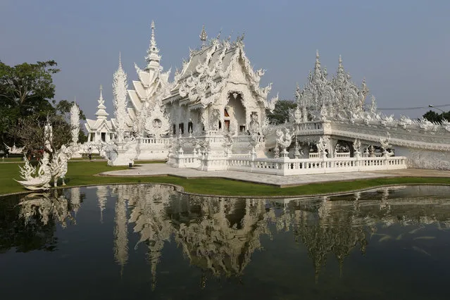View of Wat Rong Khun also know as the White Temple designed by Thai visual artist Chalermchai Kositpipat in Chiang Rai Province, Thailand March 4, 2016. (Photo by Jorge Silva/Reuters)
