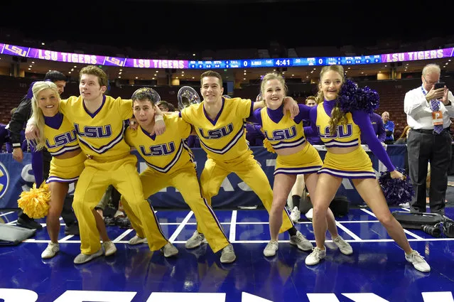 LSU cheerleaders perform during the first half of an women's Southeastern conference NCAA college basketball tournament game against Tennessee Thursday, March 7, 2019, in Greenville, S.C. (Photo by Richard Shiro/AP Photo)