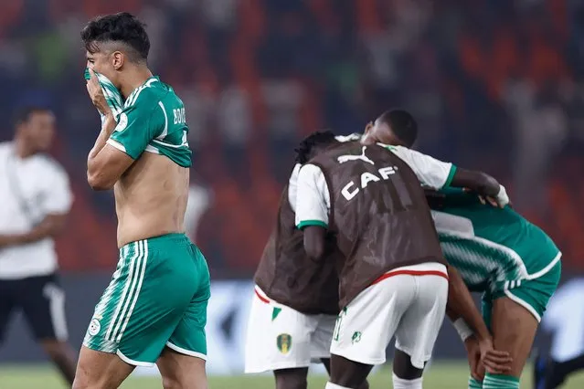 Algeria's forward #9 Baghdad Bounedjah reacts after Mauritania won the Africa Cup of Nations (CAN) 2024 group D football match between Mauritania and Algeria at Stade de la Paix in Bouake on January 23, 2024. (Photo by Kenzo Tribouillard/AFP Photo)