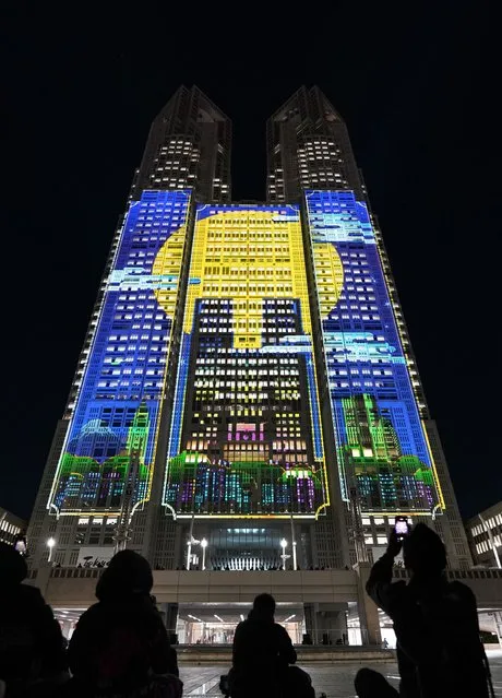 The Tokyo Metropolitan Government Building No. 1 is lit up with projection mapping which was recognized by Guinness World Records as the “largest architectural projection-mapped display” in Tokyo on February 26, 2024. (Photo by Kazuhiro Nogi/AFP Photo)