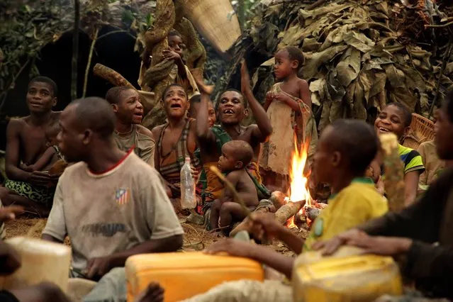 Ba'aka pygmies in their forest home, February 2016. Here, they enact their traditional hunting ceremony. (Photo by Susan Schulman/Barcroft Images)