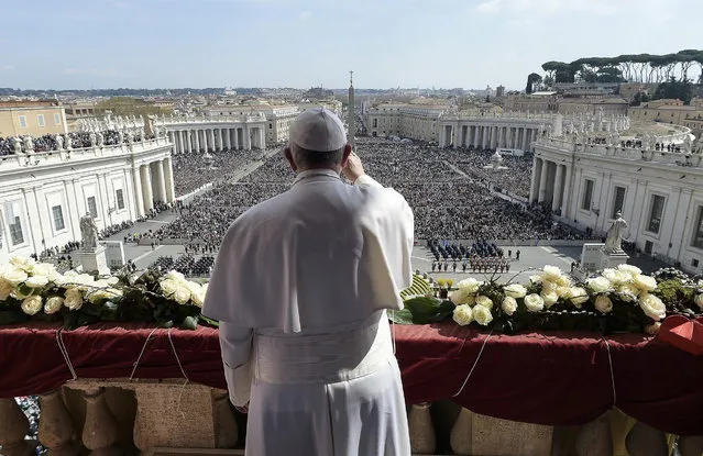 A handout photo provided by Vatican newspaper Osservatore Romano shows Pope Francis delivering the Urbi et Orbi message to conclude Easter Mass at Saint Peter's Square, Vatican City, 27 March 2016. Easter is a Christian celebration commemorating the resurrection of Jesus Christ. (Photo by Osservatore Romano/EPA)