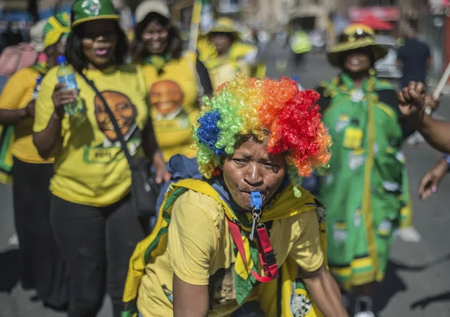 African National Congress (ANC) supporters gather outside the party's headquarters in downtown Johannesburg, Sunday, May 12, 2019 to celebrate the party's win in elections. South Africans voted Wednesday with results showing that the ruling ANC has won the national elections but has seen its share of the vote drop significantly. (Photo by Mujahid Safodien/AP Photo)