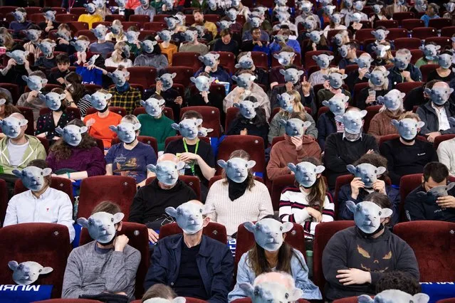 Audience members wear lamb masks ahead of the “Lamb” Gala Screening on December 08, 2021 in London, England. “Lamb” is a folk tale about loneliness set on a remote farm in Iceland that stars Noomi Rapace. (Photo by Jeff Spicer/Getty Images for MUBI)