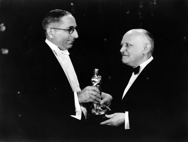 Carl Laemmle, right, acceptor, Outstanding Production (All quiet on the western front, 1930), and presenter Louis B. Mayer at the 1929/30 (3rd) Academy Awards ceremony. (Photo by AMPAS)
