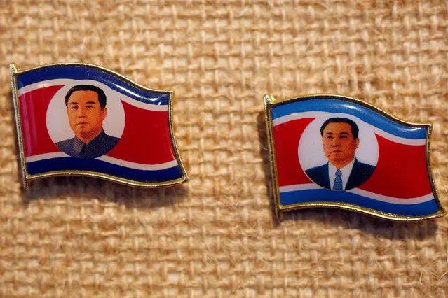 Two pins featuring former North Korean leader Kim Il Sung wearing different clothing are displayed in a glass case of Thomas Hui at his apartment in Hong Kong, China April 11, 2016. (Photo by Bobby Yip/Reuters)