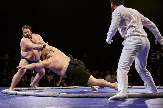 Jared Tadlock, left, and Chiyotairyu Hidemasa compete during a sumo event at Madison Square Garden on Saturday, April 13, 2024, in New York. (Photo by Andres Kudacki/AP Photo)