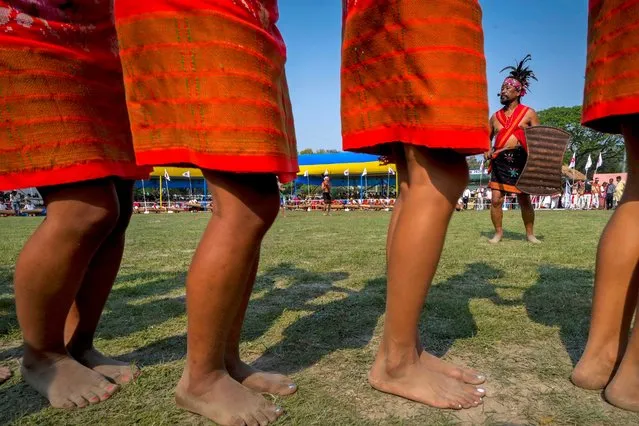 Girls from the Garo tribe perform a traditional Wangala dance during the Rongali Bihu festival, organized by All Assam Students Union in Guwahati, capital of the north eastern state of Assam, India, Saturday, April 13, 2024. (Photo by Anupam Nath/AP Photo)