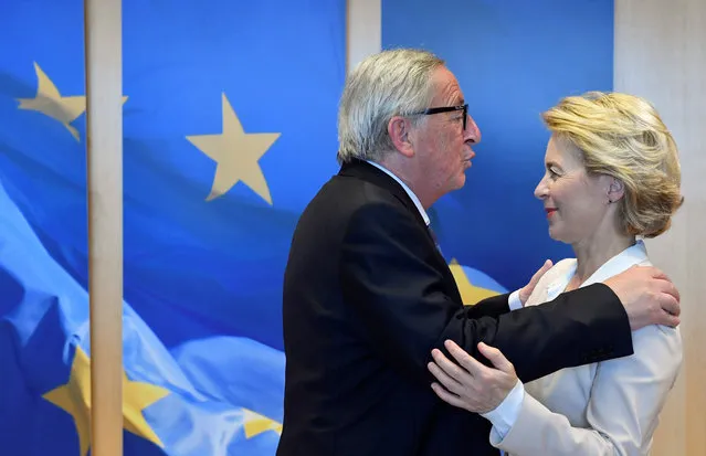 Outgoing president of the European Commission Jean-Claude Juncker (L) welcomes German Defence Minister and newly-appointed EU Commission Chief Ursula von der Leyen, on July 23, 2019, 2019 in Brussels. (Photo by John Thys/AFP Photo)