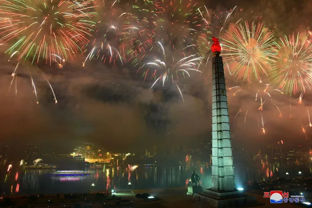 Fireworks light up the skies over the North Korean capital, Pyongyang, as a parade is held to mark the 73rd anniversary of the nation’s founding at Kim Il-sung Square on September 9, 2021. (Photo by KCNA via KNS/AFP Photo/Stringer)