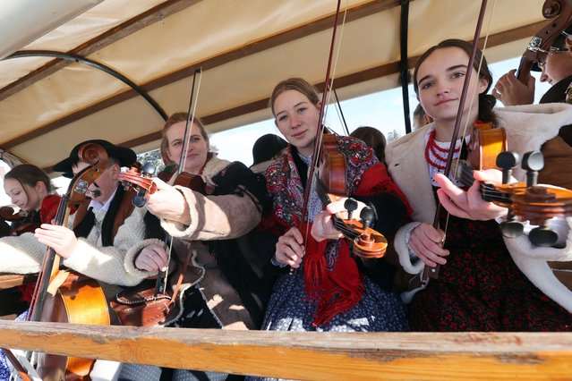 Polish highlanders in traditional outfits take part in the pageant opening of the 51st Highland Carnival in Bukowina Tatrzanska, in the Tatra Mountains, southern Poland, 09 February 2023. Traditionally, carnival begins with the passing of bands and invited guests through the streets of Bukowina Tatrzanska. Carol singers and traditional dance performances are also planned for the event. (Photo by Grzegorz Momot/EPA)