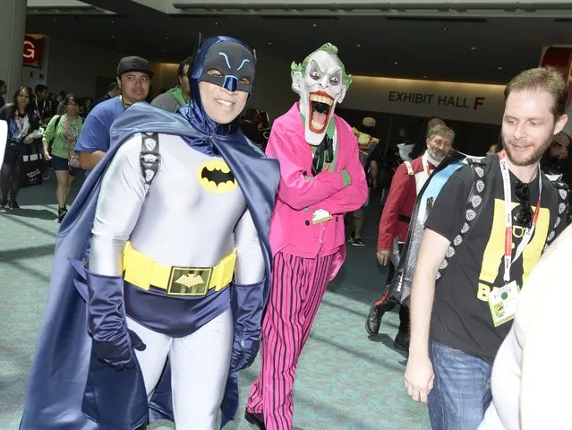 Cosplayers in Batman and Joker costumes attend the third day of Comic Con International in San Diego, California, July 11, 2015. (Photo by Robyn Beck/AFP Photo)