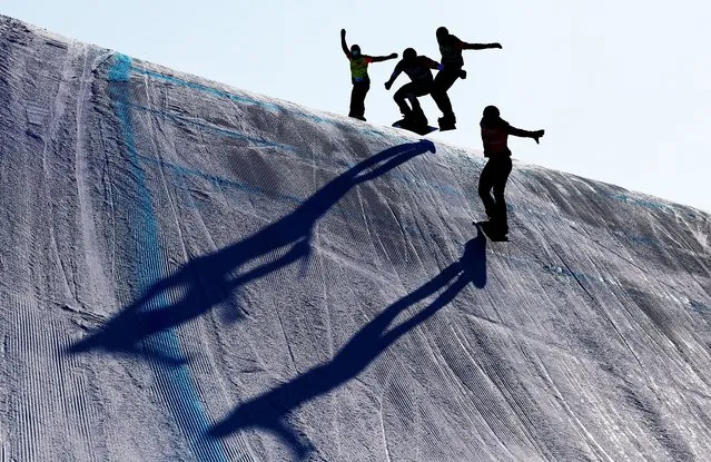 Athletes compete during the Men's Snowboard Cross Quarter Finals on Day 6 of the Beijing 2022 Winter Olympics at Genting Snow Park on February 10, 2022 in Zhangjiakou, China. (Photo by Clive Rose/Getty Images)