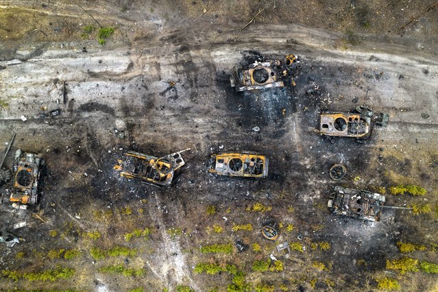 Destroyed Russian armored vehicles sit on the outskirts of Kyiv, Ukraine, Thursday, March 31, 2022. (Photo by Rodrigo Abd/AP Photo)
