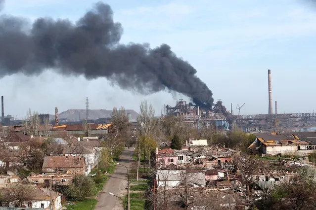 Smoke rises above a plant of Azovstal Iron and Steel Works during Ukraine-Russia conflict in the southern port city of Mariupol, Ukraine on April 25, 2022. (Photo by Alexander Ermochenko/Reuters)