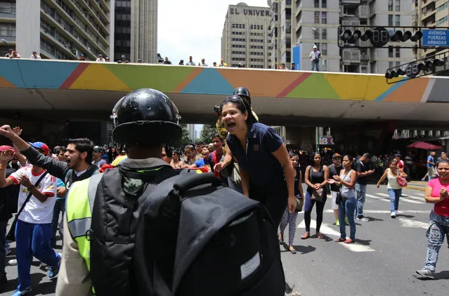 A demonstrator yells during a protest demanding food near Miraflores presidential palace in Caracas, Venezuela, Thursday, June 2, 2016. (Photo by Fernando Llano/AP Photo)
